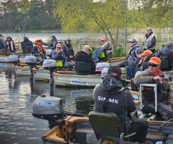 A group of fishermen sitting on boats