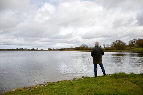 Man out fishing by the lakeside