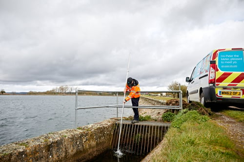 Bristol Water worker cleaning out a drain connected to the reservoir