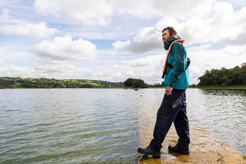 Bristol Water worker stood by the lakeside
